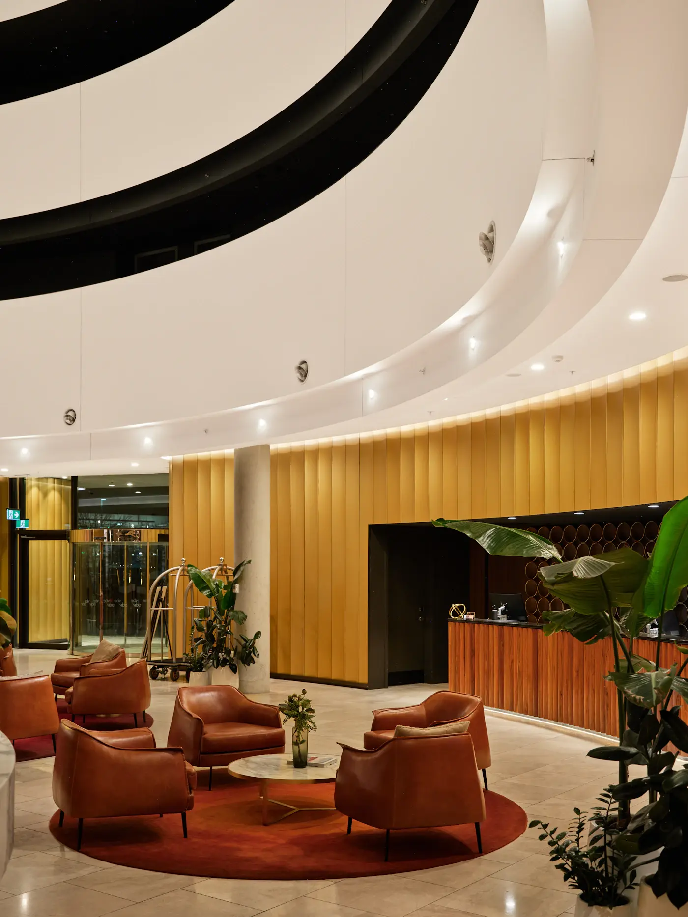 A modern hotel lobby with a reception desk